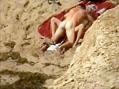 Voyeur spies sex from the cliffs