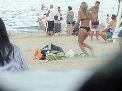 Drunk blond girl gets dirty on beach