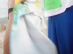 Drunk blond girl gets dirty on beach