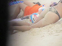 Drunk blond girl gets dirty on beach