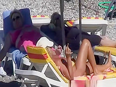 Topless women enjoying the sun