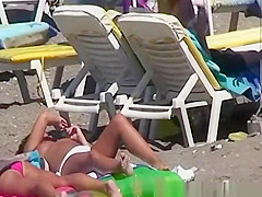 Topless women enjoying the sun