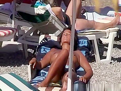 Topless women enjoying the sun