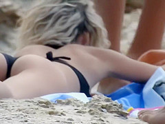 Massive natural tits on a beach