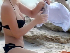 Massive natural tits on a beach