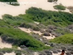 Massive natural tits on a beach