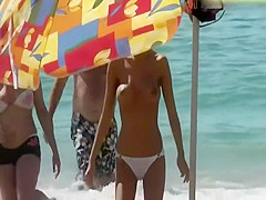 Sexy topless girl in a white bikini