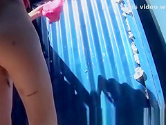 Girl dresses in pink swimsuit