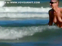 Hot body of an older woman in the water