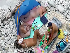 Funny nude whales spied on a beach