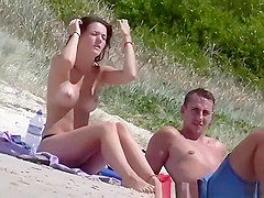 Topless brunette girl in the beach