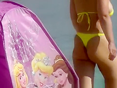 Sexy ass woman in yellow thong bikini