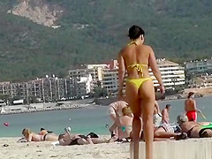 Sexy ass woman in yellow thong bikini