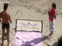 He caresses her butt while she sucks him