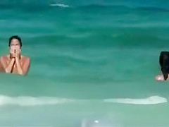 Topless girls running in the water