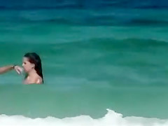 Topless girls running in the water