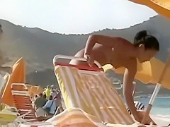 Sweet fake boobs on a beach