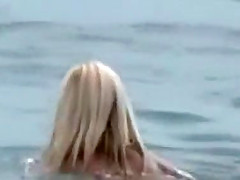 Serbian folk singer spied on a beach