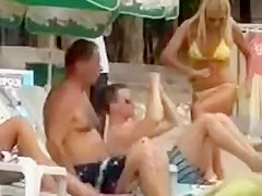 Serbian folk singer spied on a beach