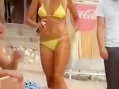 Serbian folk singer spied on a beach