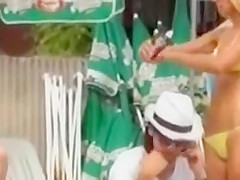 Serbian folk singer spied on a beach