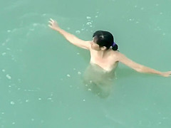 Spying two teenagers fuck in the water