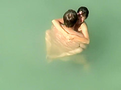 Spying two teenagers fuck in the water