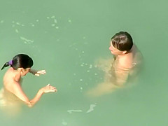 Spying two teenagers fuck in the water