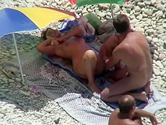 Nudist caresses his wife