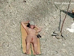 Girl spied as she tans without a bikini