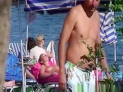 Topless women sunbathing