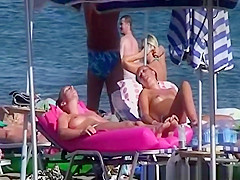 Topless women sunbathing
