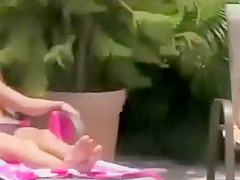 Teenage girls peeped topless at a pool