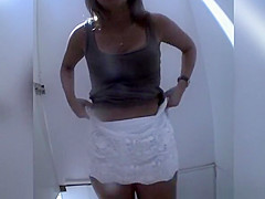 Gals caught in beach cabin changing