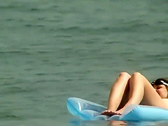 Couple plays around on an air mattress