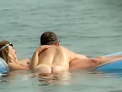 Couple plays around on an air mattress