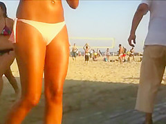 Hot beach babe waits for her friend