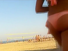 Hot beach babe waits for her friend