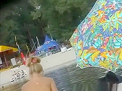 Blonde nudist woman sunbathing