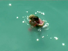 Couple kissing and fucking in the water