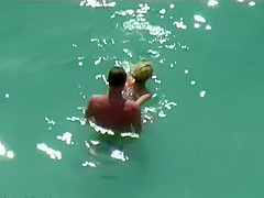 Couple kissing and fucking in the water