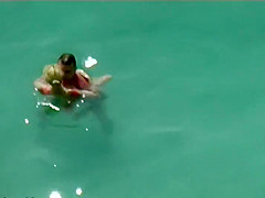 Couple kissing and fucking in the water