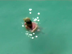 Couple kissing and fucking in the water