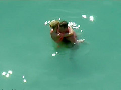 Couple kissing and fucking in the water