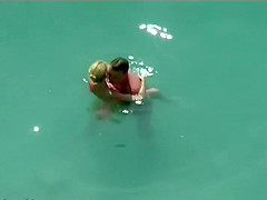 Couple kissing and fucking in the water