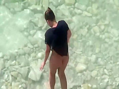 Naked woman is afraid of the sun