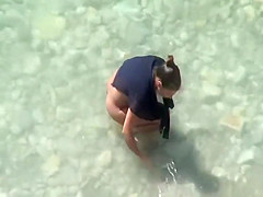 Naked woman is afraid of the sun