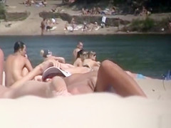 Brunette nudist woman sunbathing