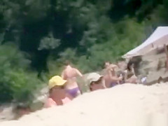 Brunette nudist woman sunbathing