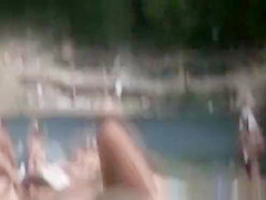 Brunette nudist woman sunbathing